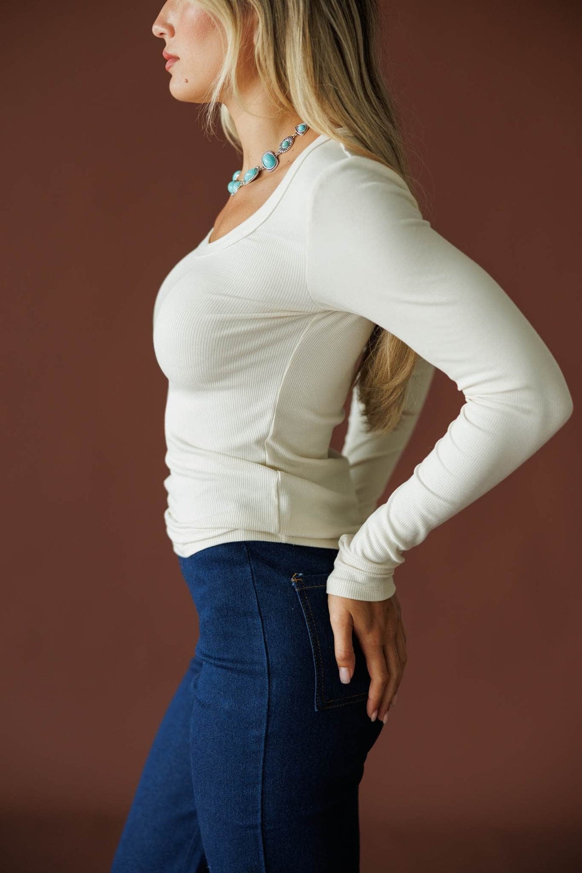 Ribbed Fitted Long Sleeve Top in natural, side view showing the fitted ribbed knit