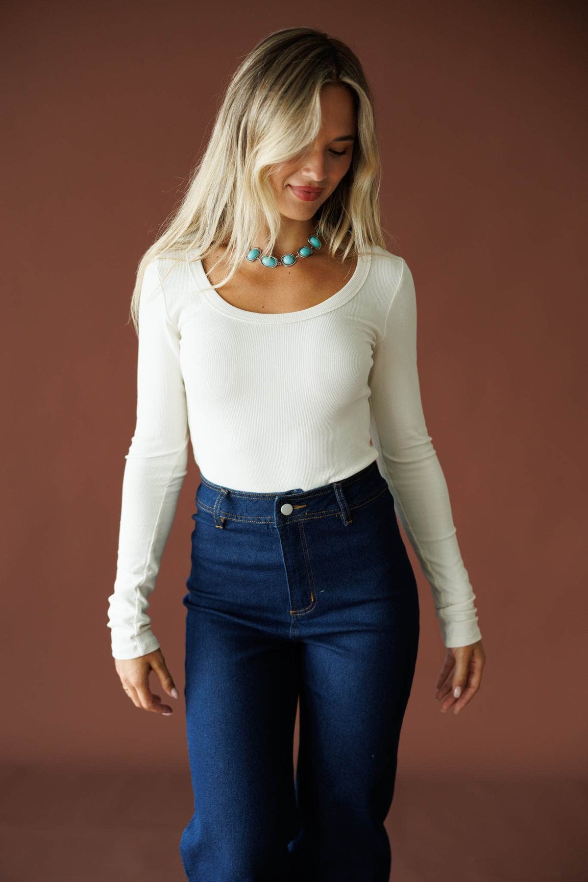 Ribbed Fitted Long Sleeve Top in natural, full-length view on model with dark wash jeans