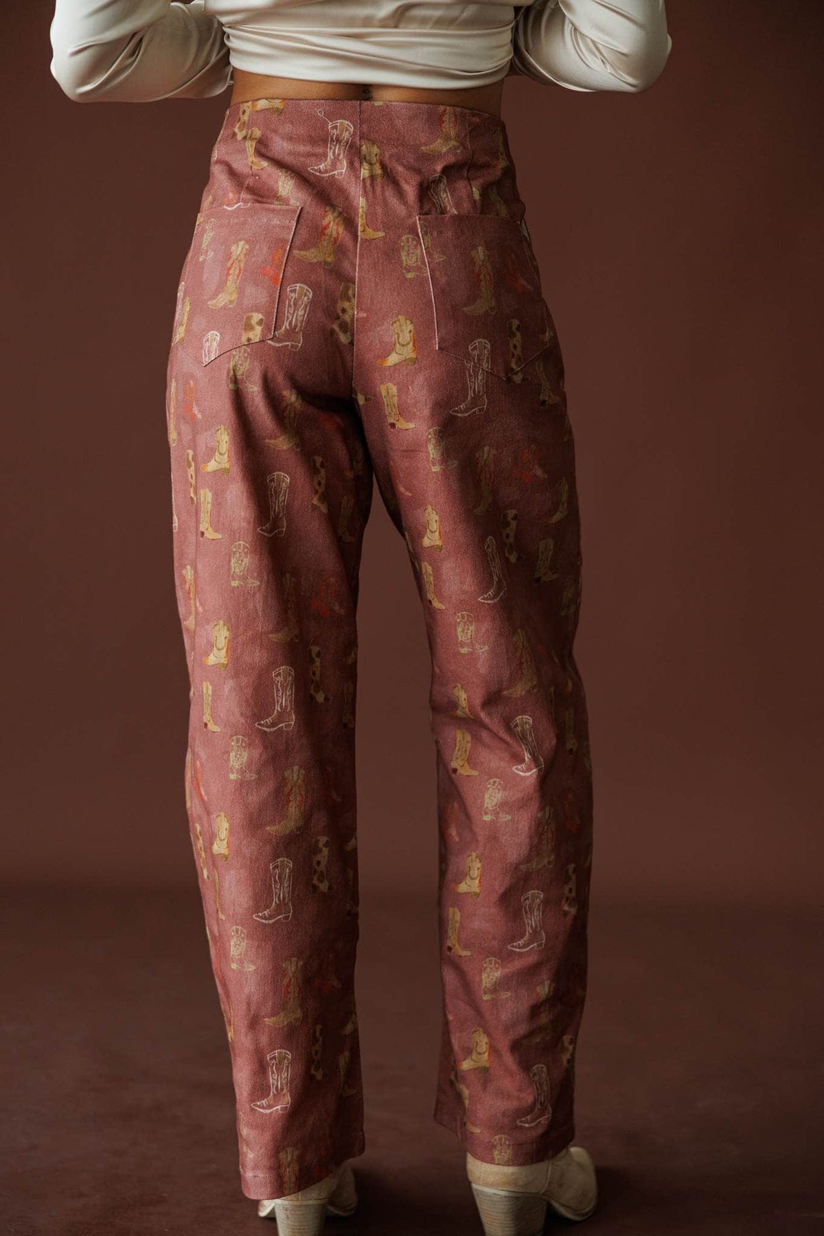 Rodeo Road Printed Pants in brick red, back view showing the straight leg printed pants