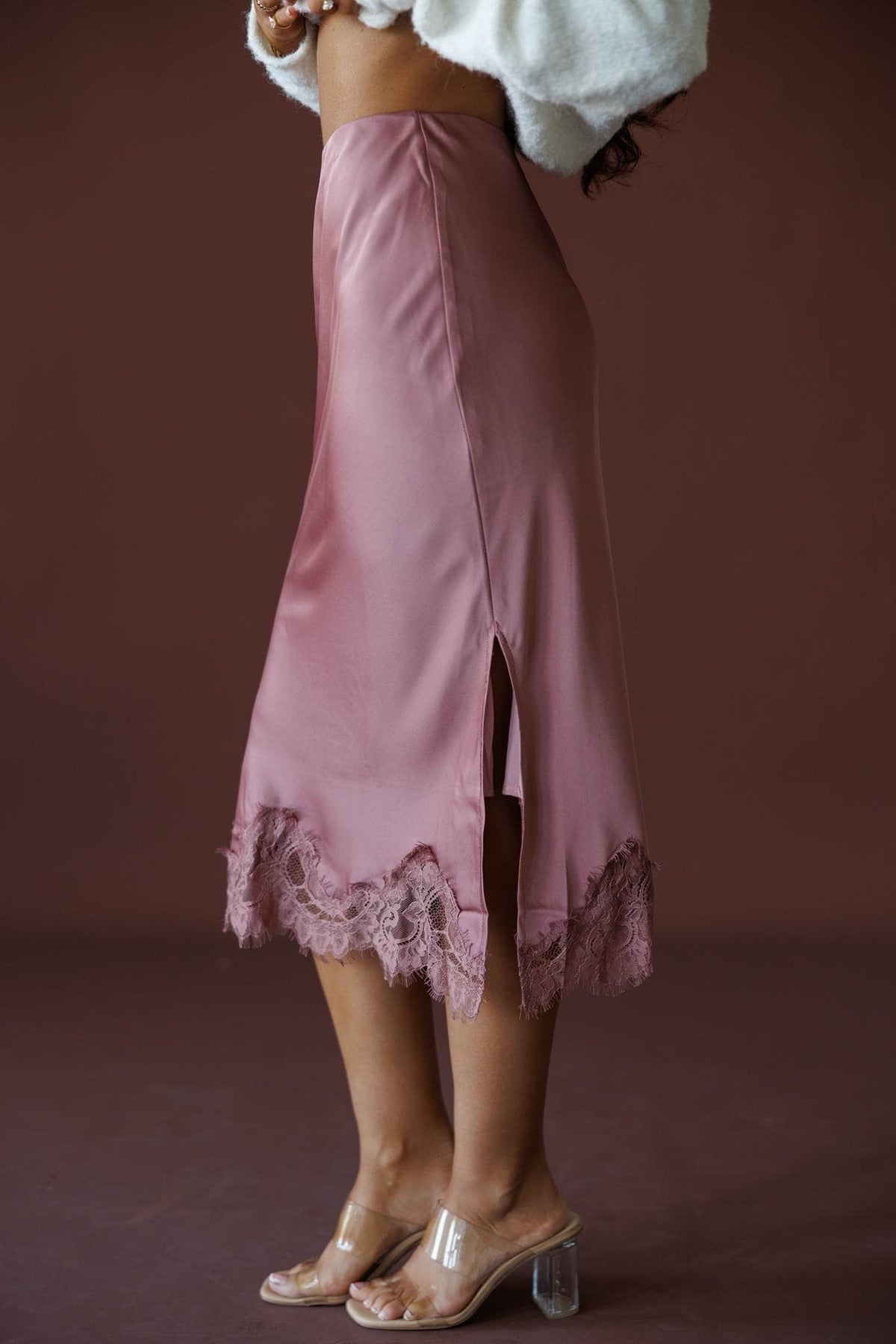 Satin Secrets Lace Midi Skirt in rose dawn, side view showing the side slit and lace hem