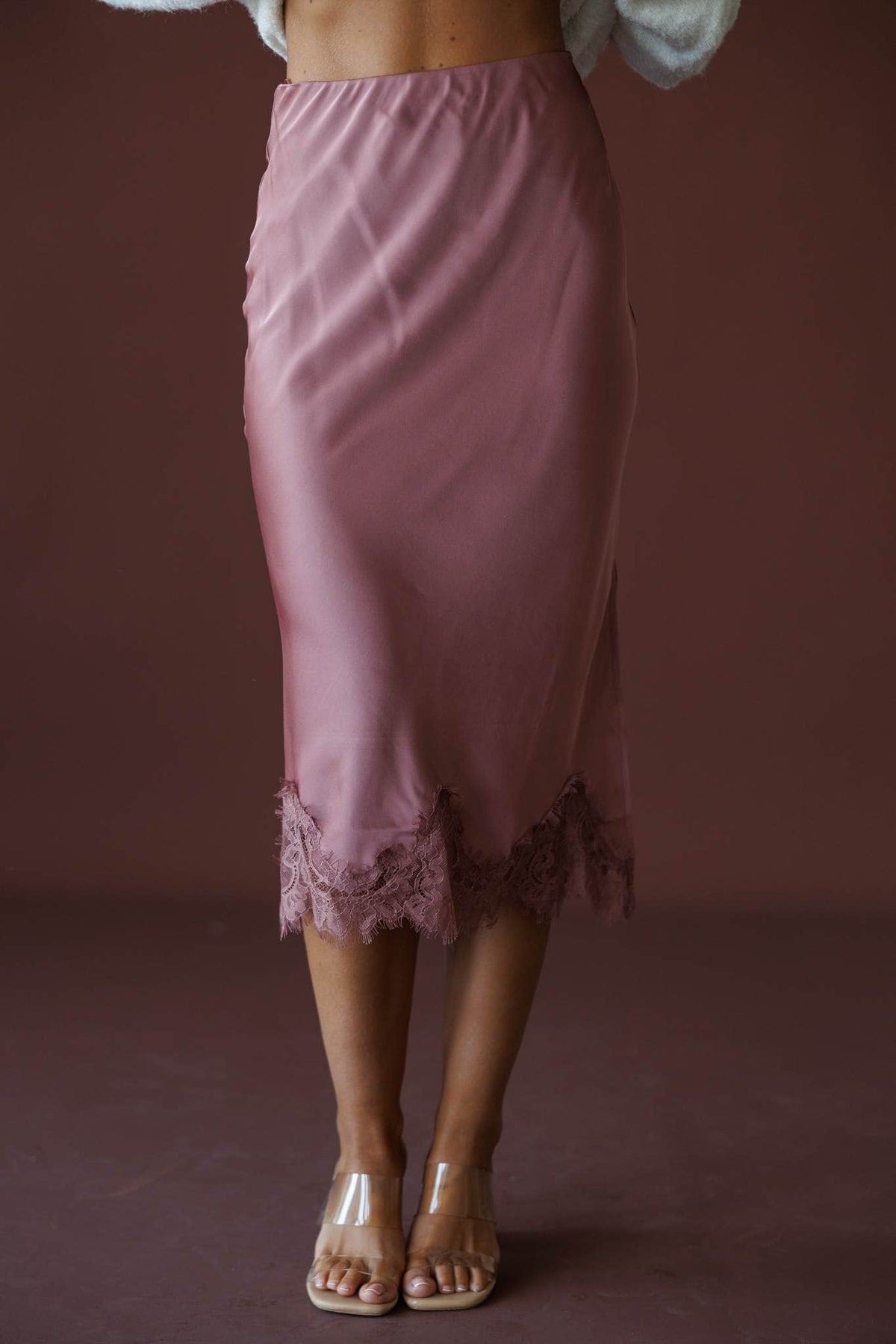 Satin Secrets Lace Midi Skirt in rose dawn, front close-up of the satin and lace hem