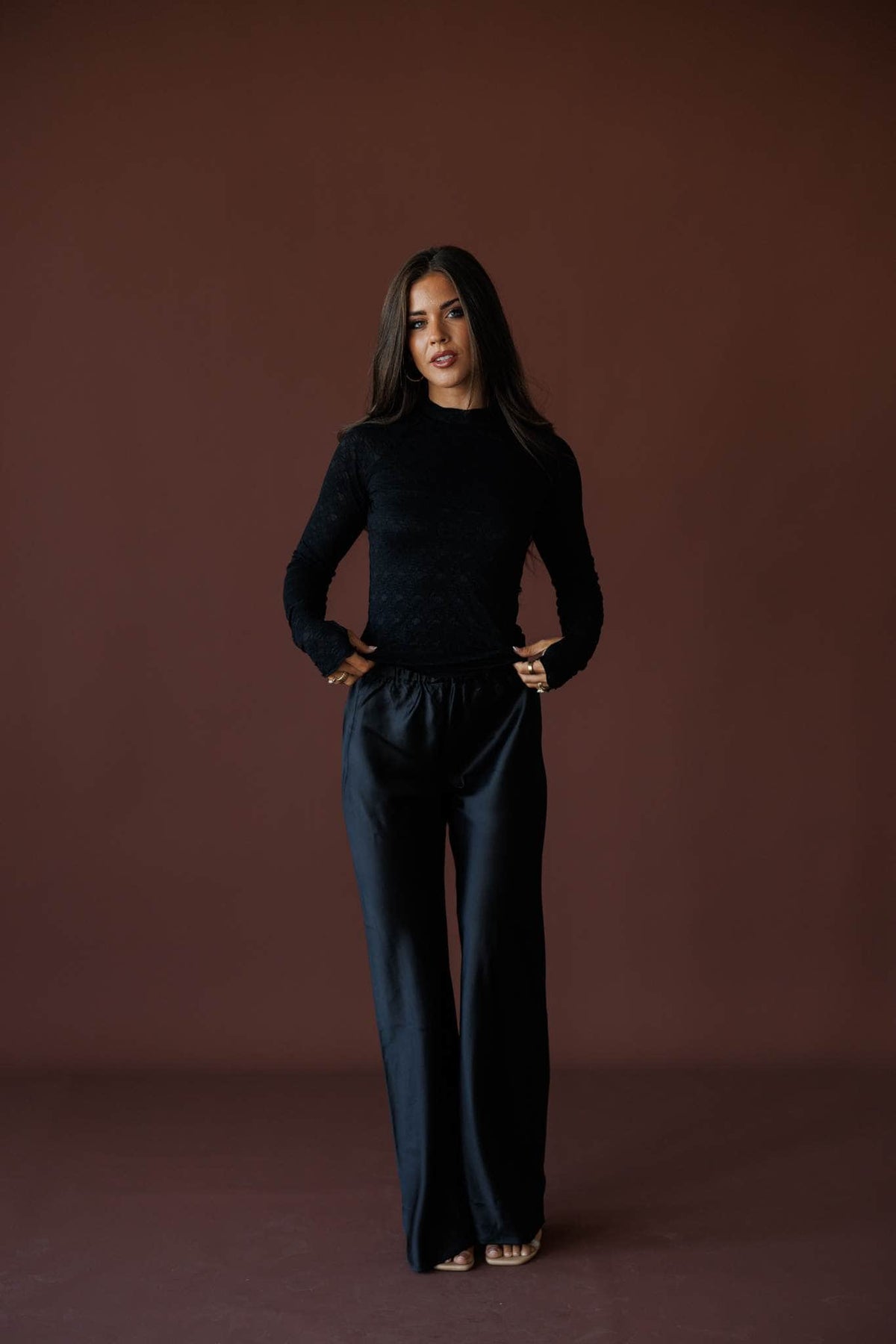 Satin State Pants in black, full-length view with a black long sleeve top