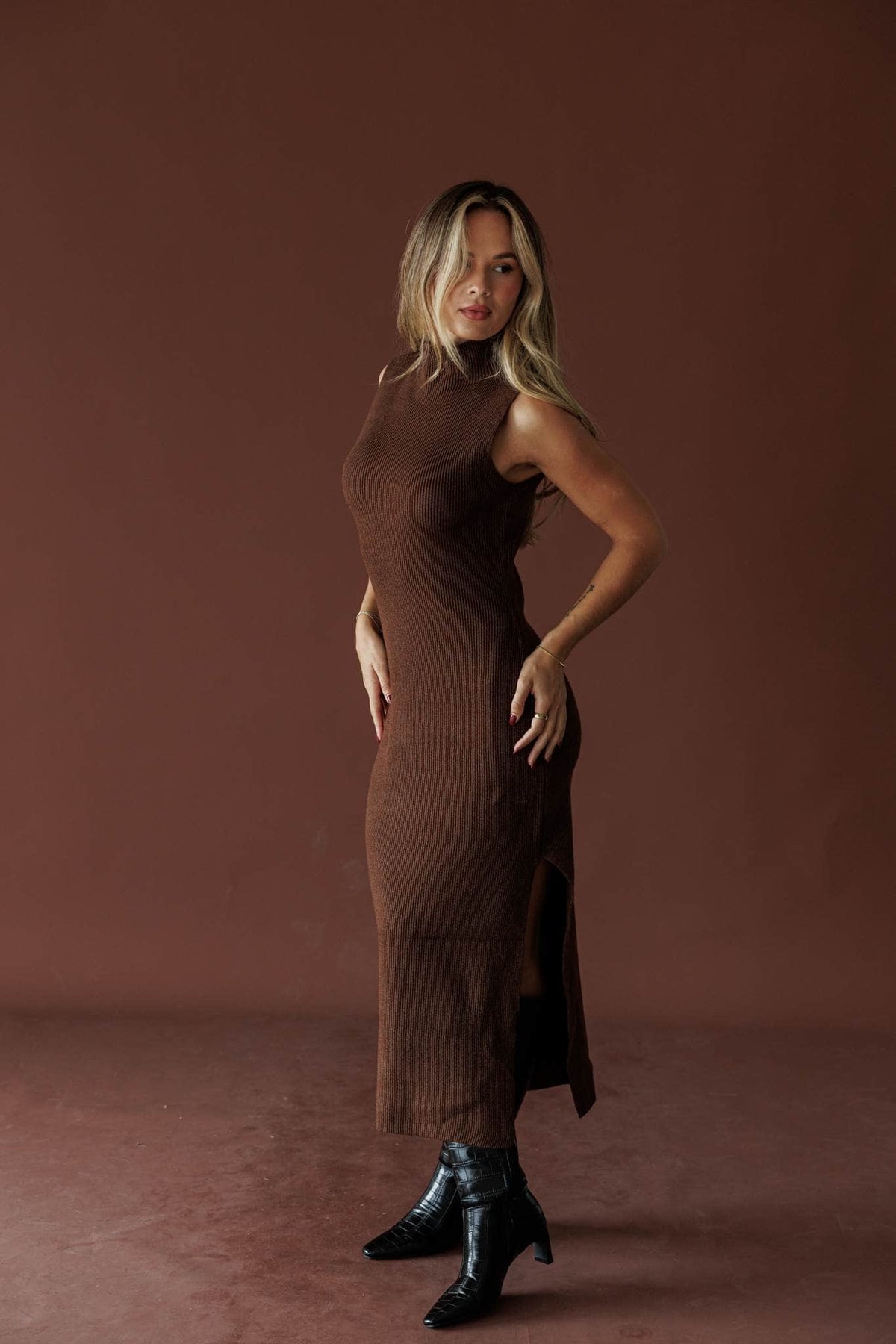 Serving Looks Sweater Dress, in chocolate, three-quarter front view with a hand on the hip