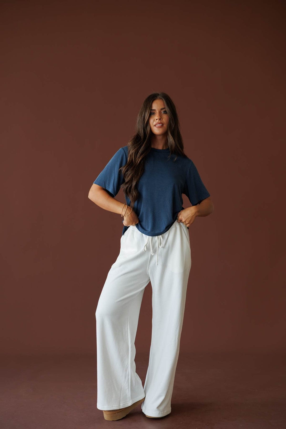 Sideline Wide Leg Pants in off white, full-length view with a navy tee