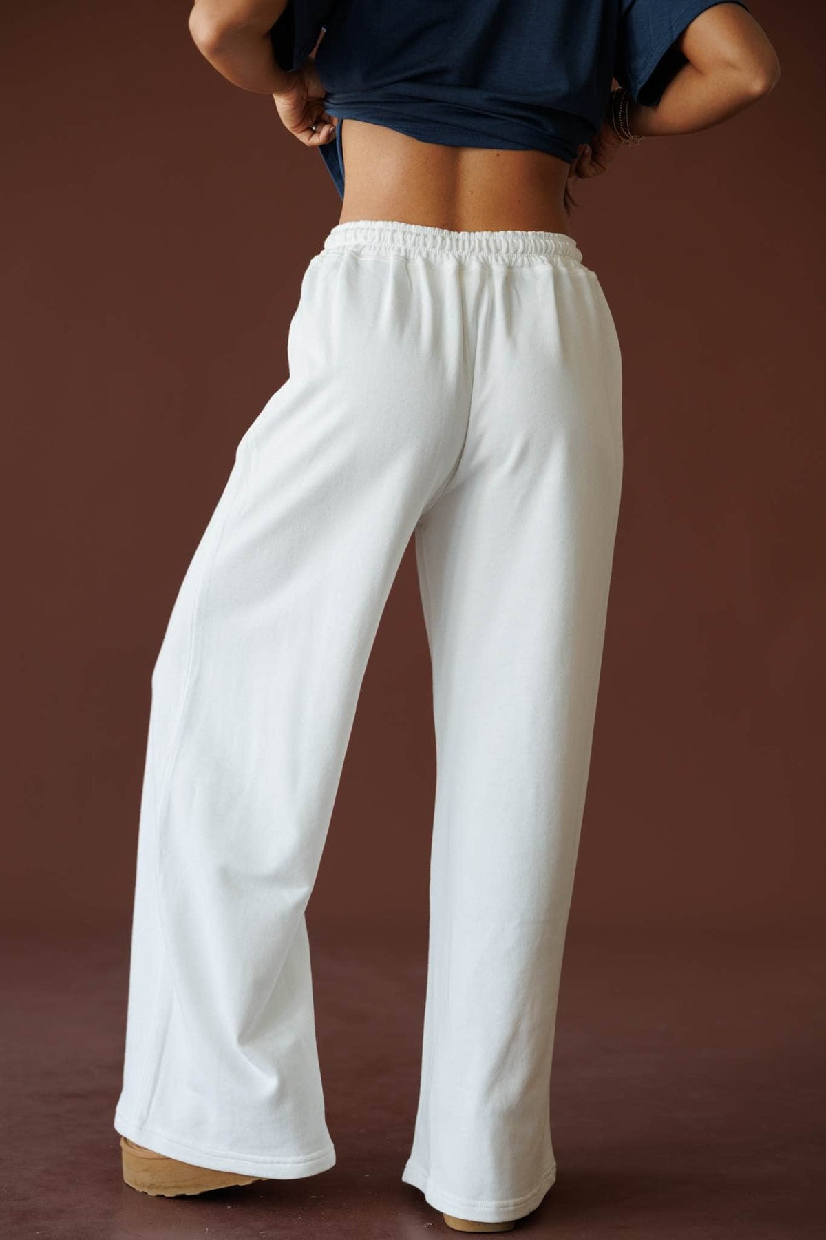 Sideline Wide Leg Pants in off white, back view showing the elastic waist and wide leg