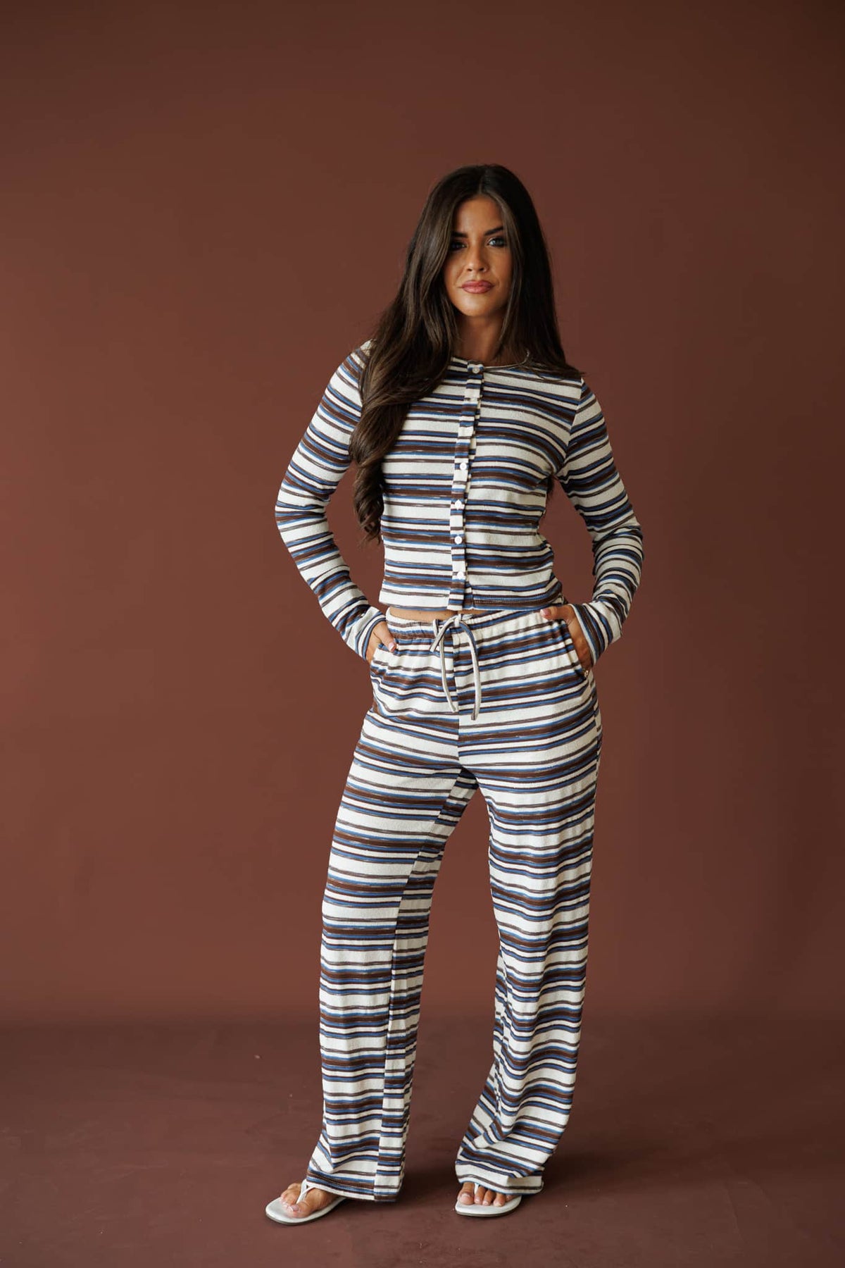 Slow Mornings Pant in blue brown stripe, full-length view on model with hands on hips