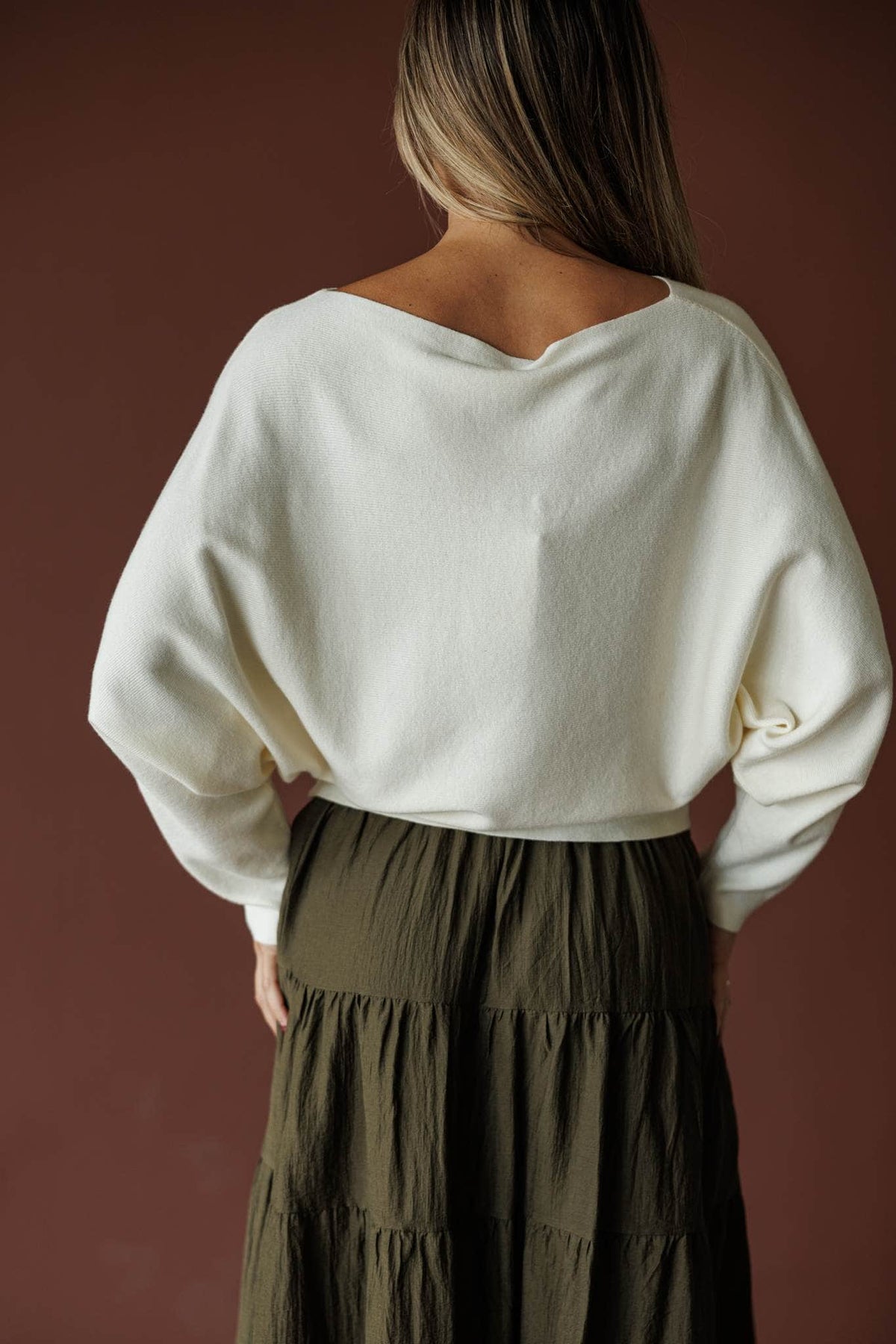 Cream boat neck knit top with blouson sleeves