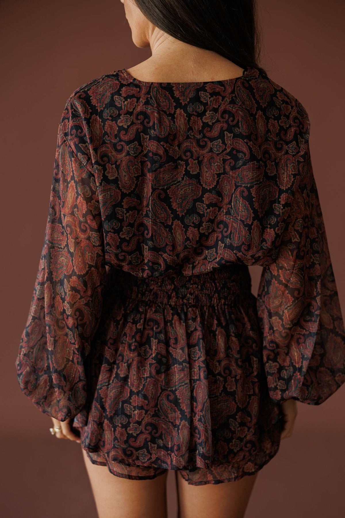 Sonora Paisley Romper in black, back view showing the sheer paisley romper