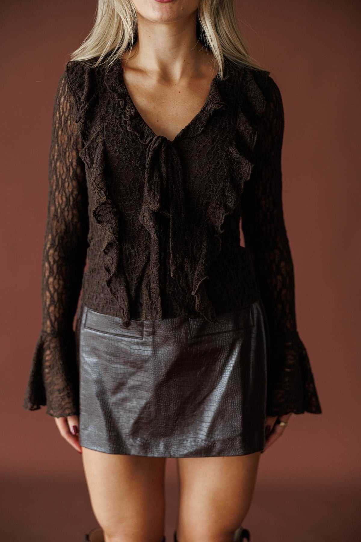 Storybook Ending Lace Top in chocolate, front close-up of the ruffle placket and sheer lace