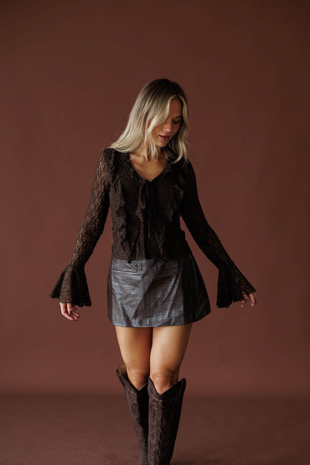 Storybook Ending Lace Top in chocolate, full-length view with a metallic mini skirt