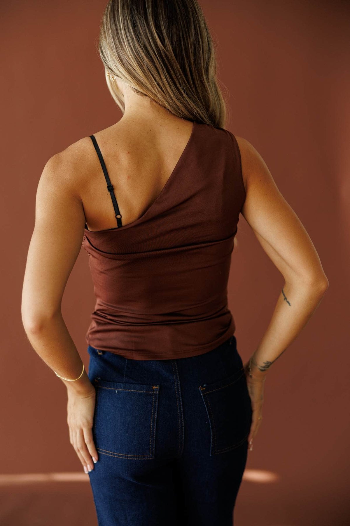 Street Stories Top in brown, back view showing the bare shoulder and fitted mesh
