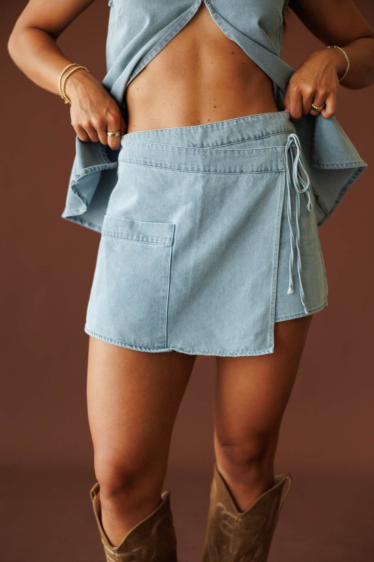 Sun Valley Denim Skort in denim, front close-up of the wrap front skort and tie