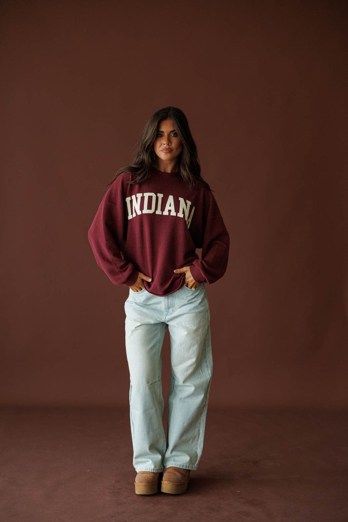 Sunbleached Barrel Jeans in light blue, full-length view with a burgundy Indiana sweatshirt