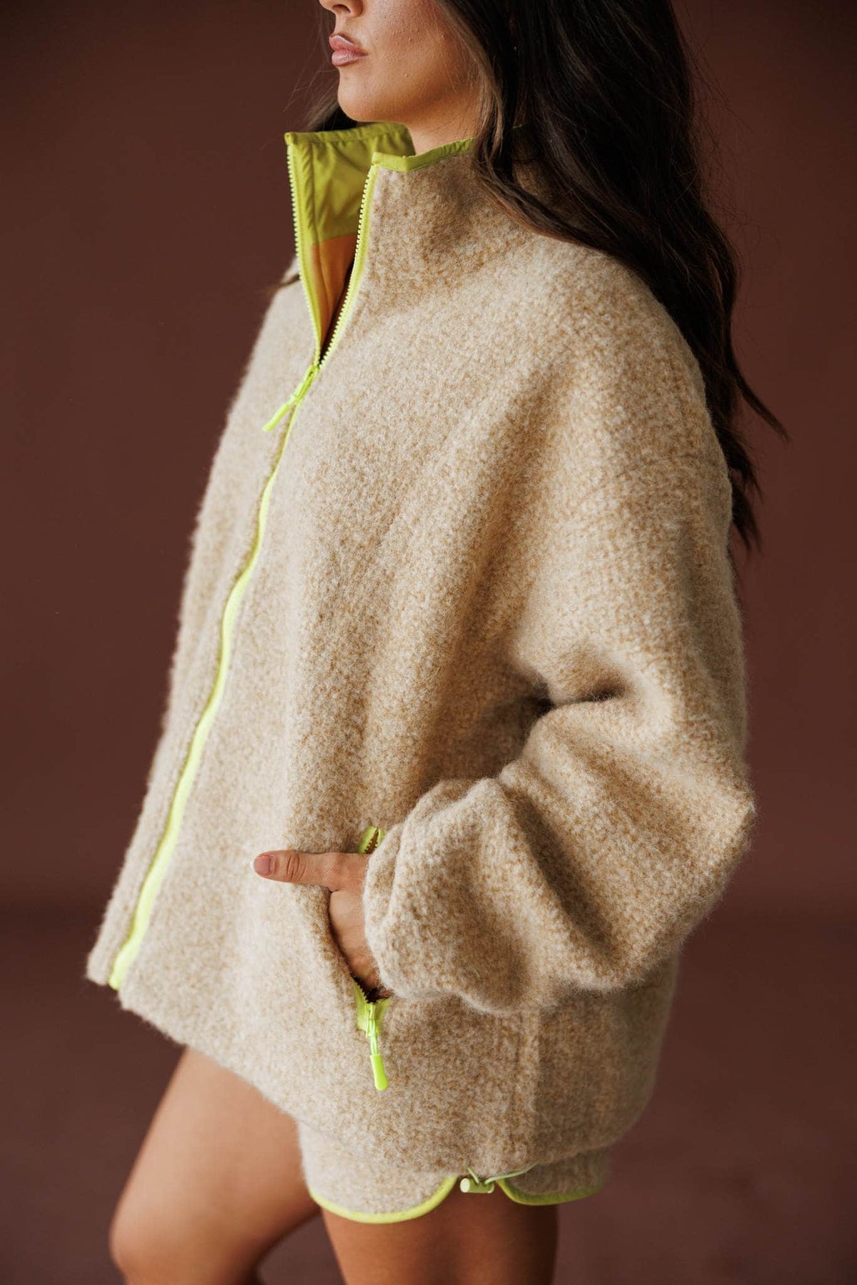 Sundance Sherpa Jacket in butter, side view showing the contrast zip and stand collar