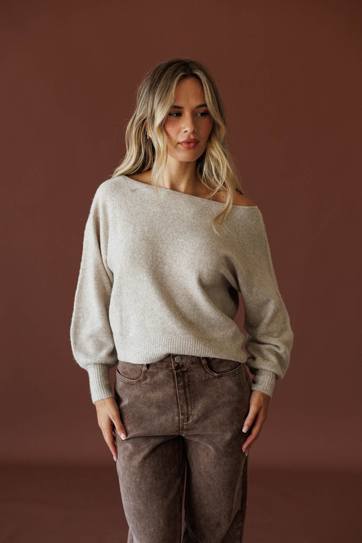 Slightly Undone Sweater in oatmeal, full-length view with brown corduroy pants