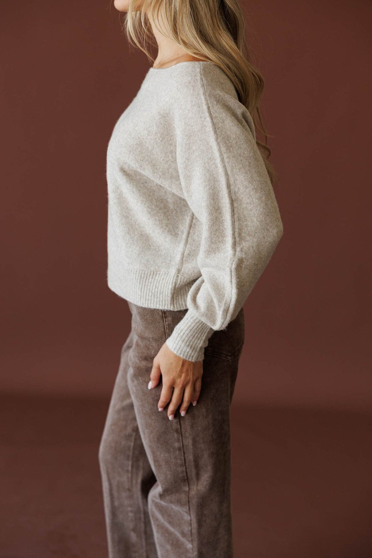Slightly Undone Sweater in oatmeal, side view showing the balloon knit sleeve