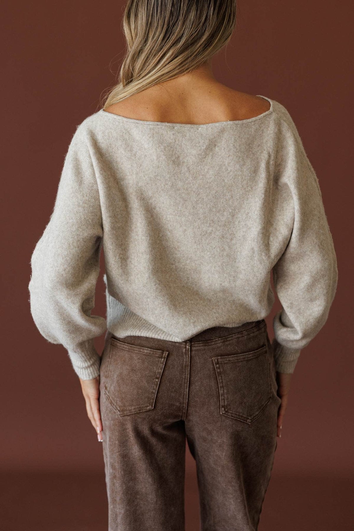 Slightly Undone Sweater in oatmeal, back view showing the wide boat neck knit