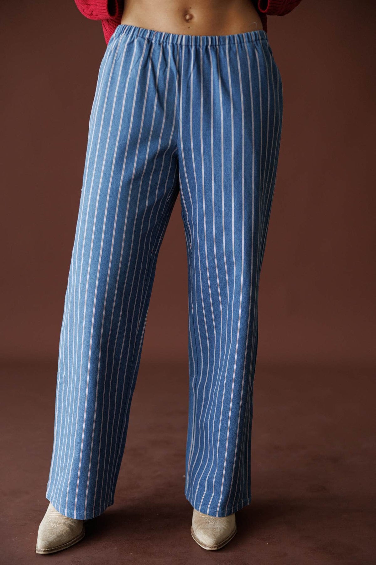 Ticking Stripe Denim Pants in washed blue, front close-up of the elastic waist striped denim