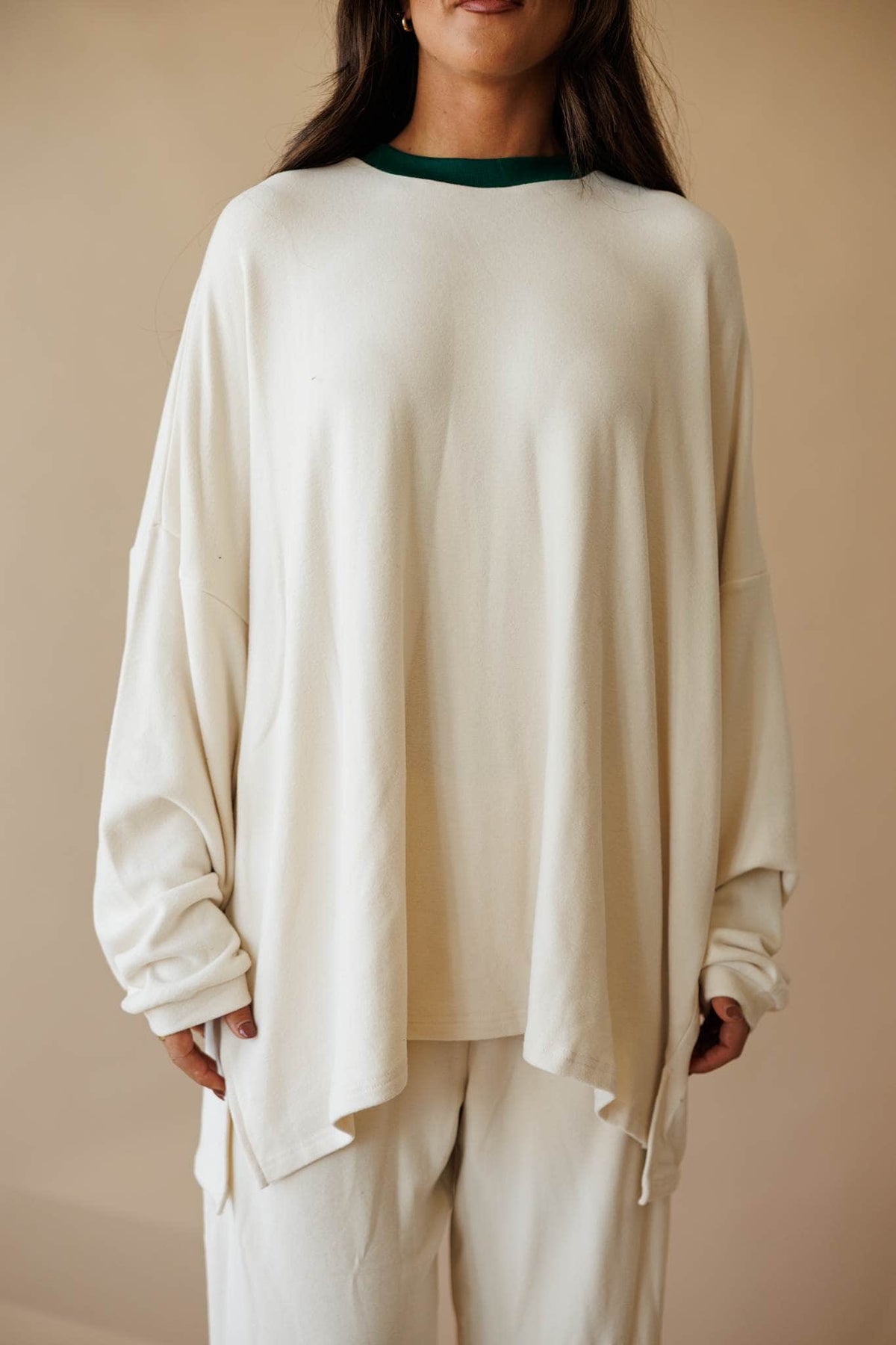 Cream oversized knit top with side slit