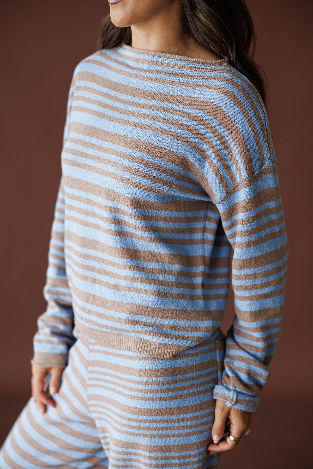 Latte Stripe Sweater in latte and blue, side view showing the cropped striped knit
