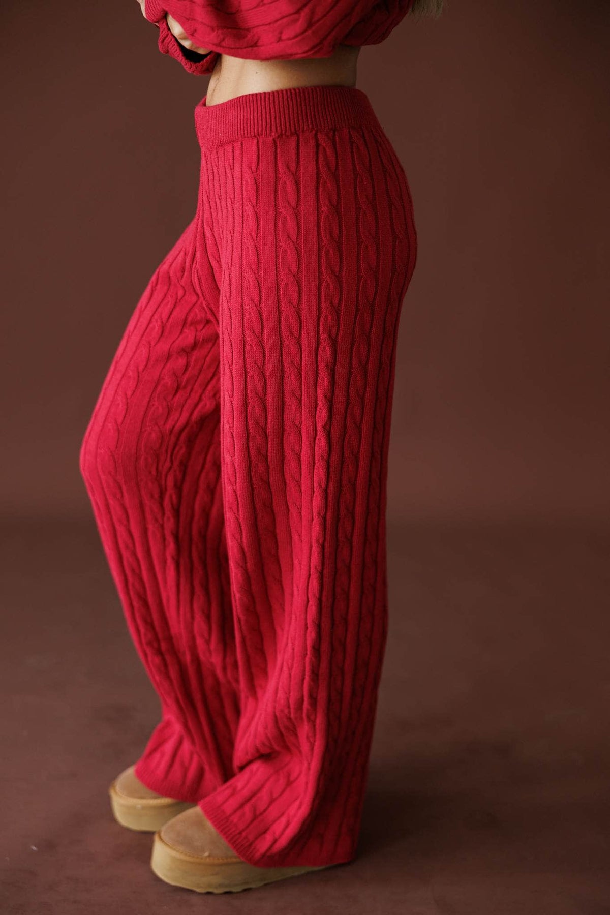 Cherry Cable Knit Pants in red, side view showing the wide leg cable knit pants