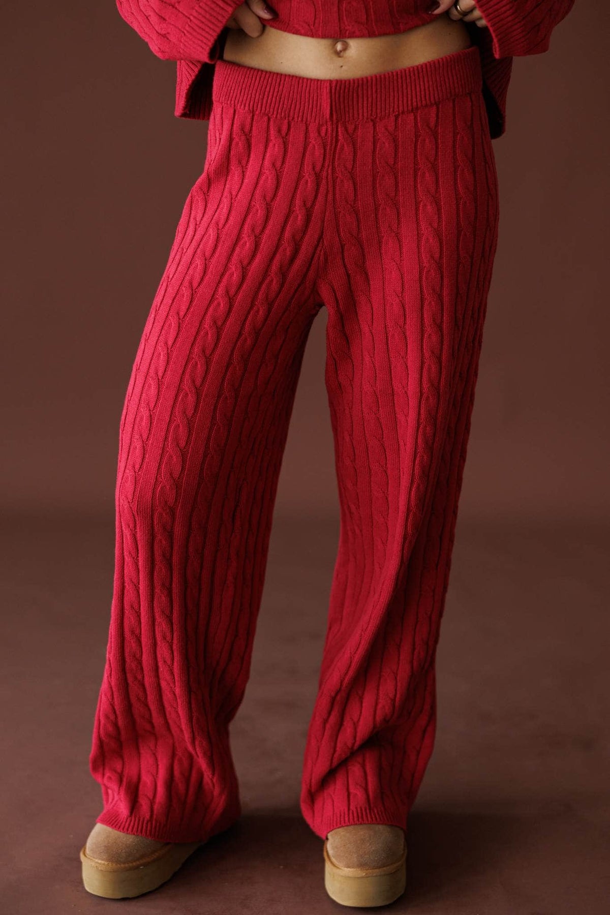 Cherry Cable Knit Pants in red, front close-up of the cable knit and elastic waist