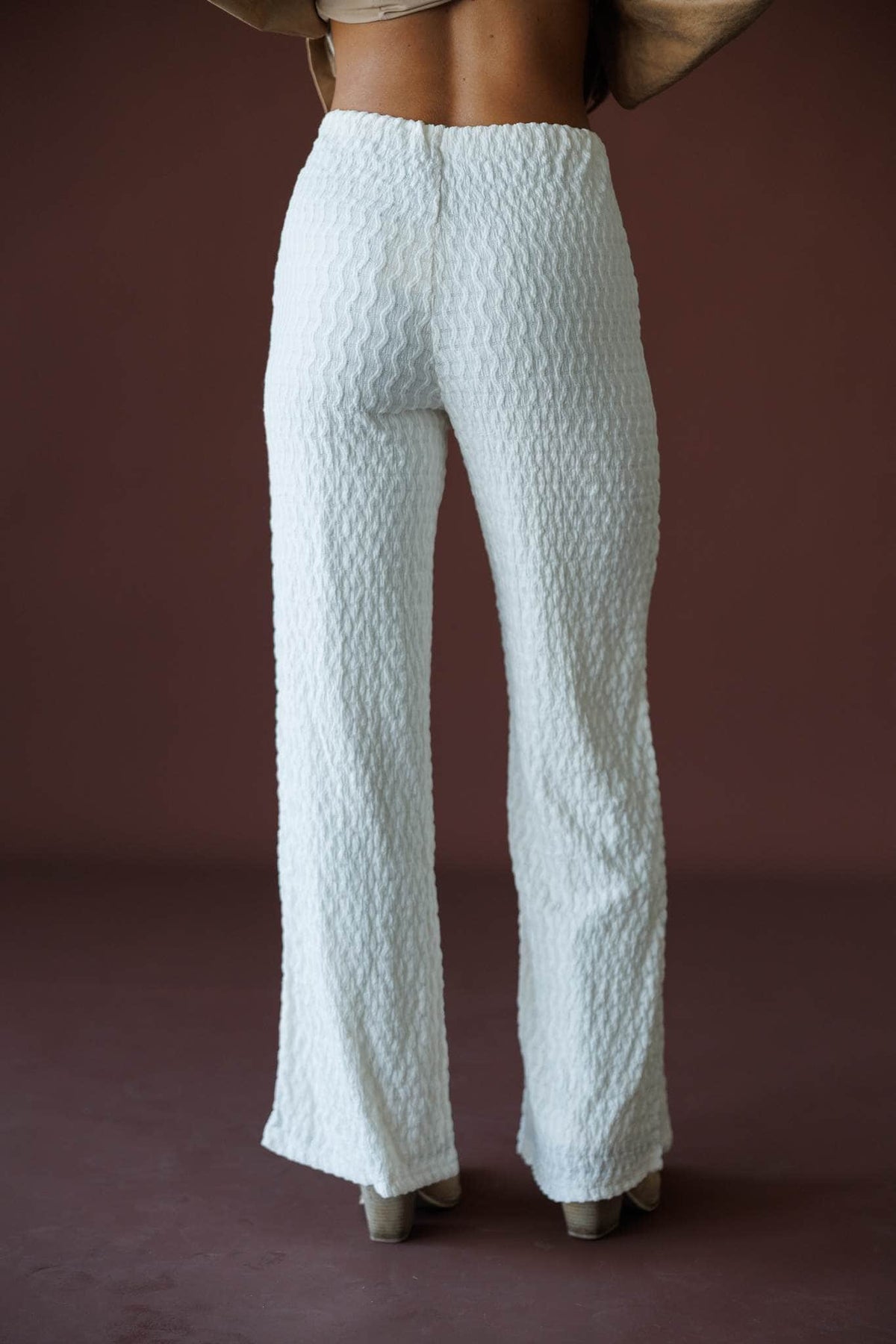 Textured Pull On Pants in ivory, back view showing the smooth waist and flared leg