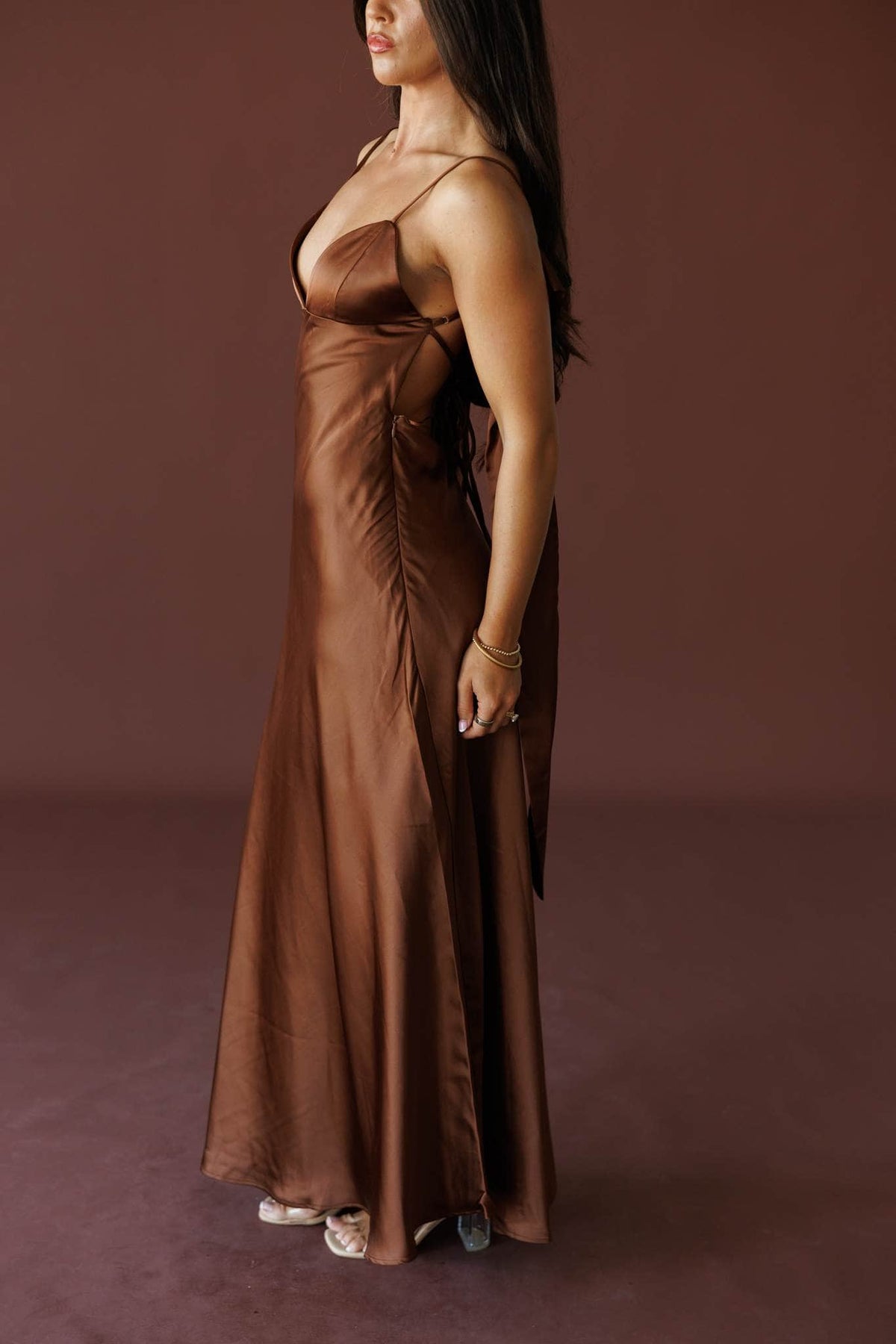 The Candlelight Dress in brown, side view showing the draped satin bodice