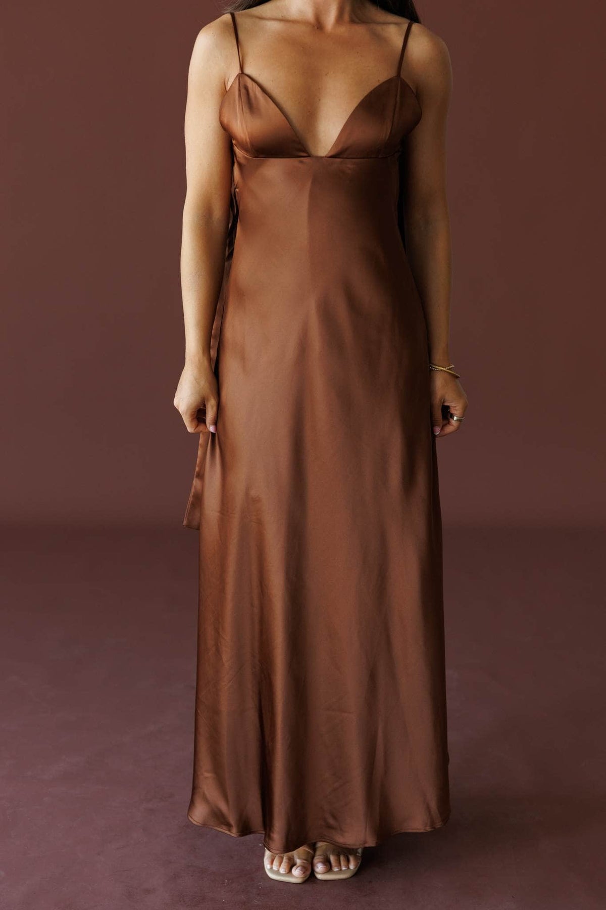 The Candlelight Dress in brown, front view showing the bias cut satin gown