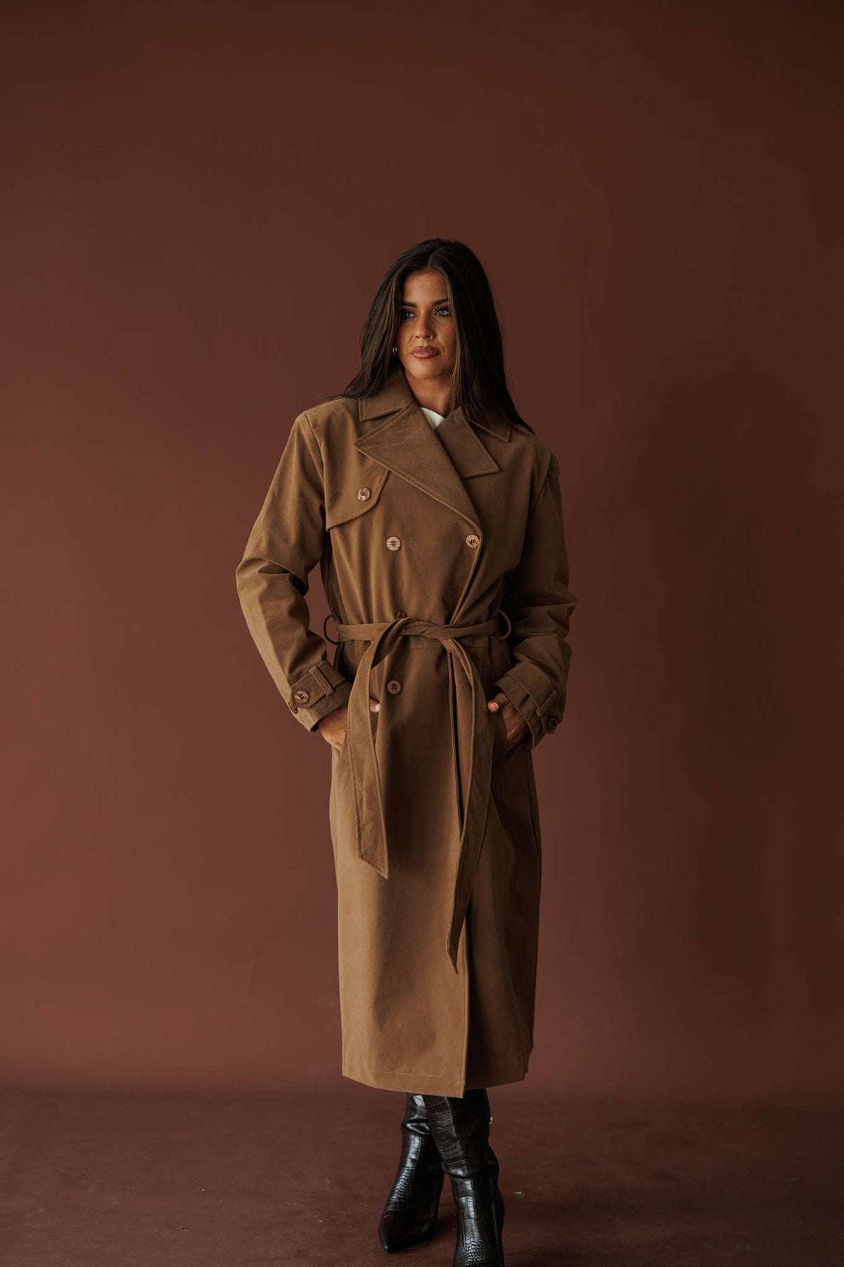 The Estate Walk Trench, in taupe, three-quarter view with hands in pockets