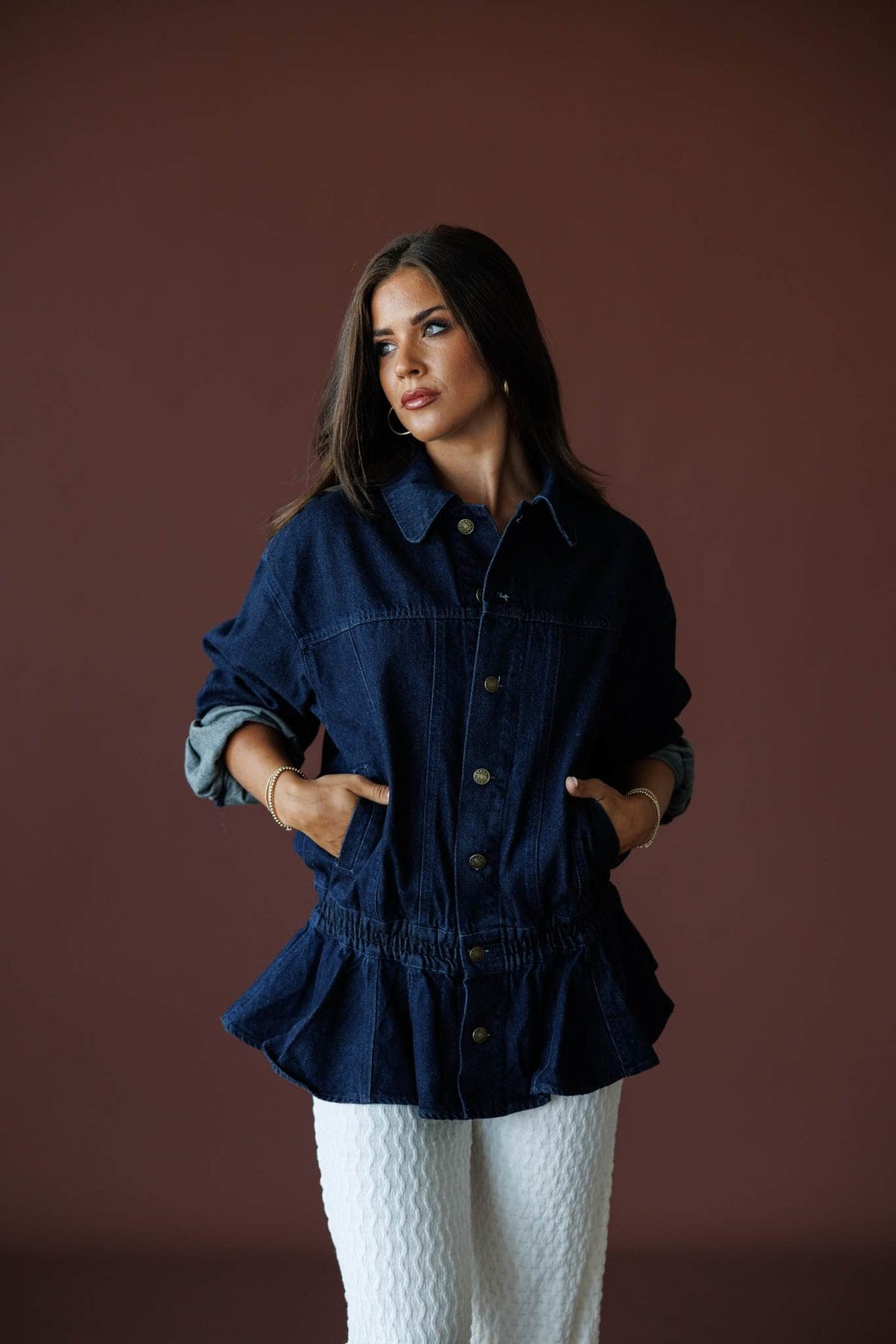 The Remix Denim Jacket in dark denim, full-length view with white textured pants