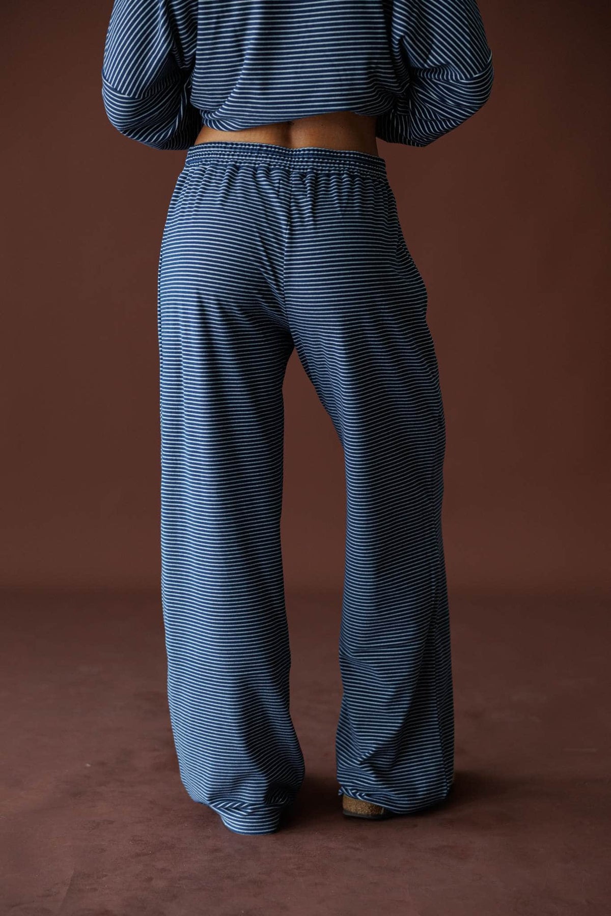 The Social Club Fleece Pants in navy, back view showing the wide leg ribbed fleece