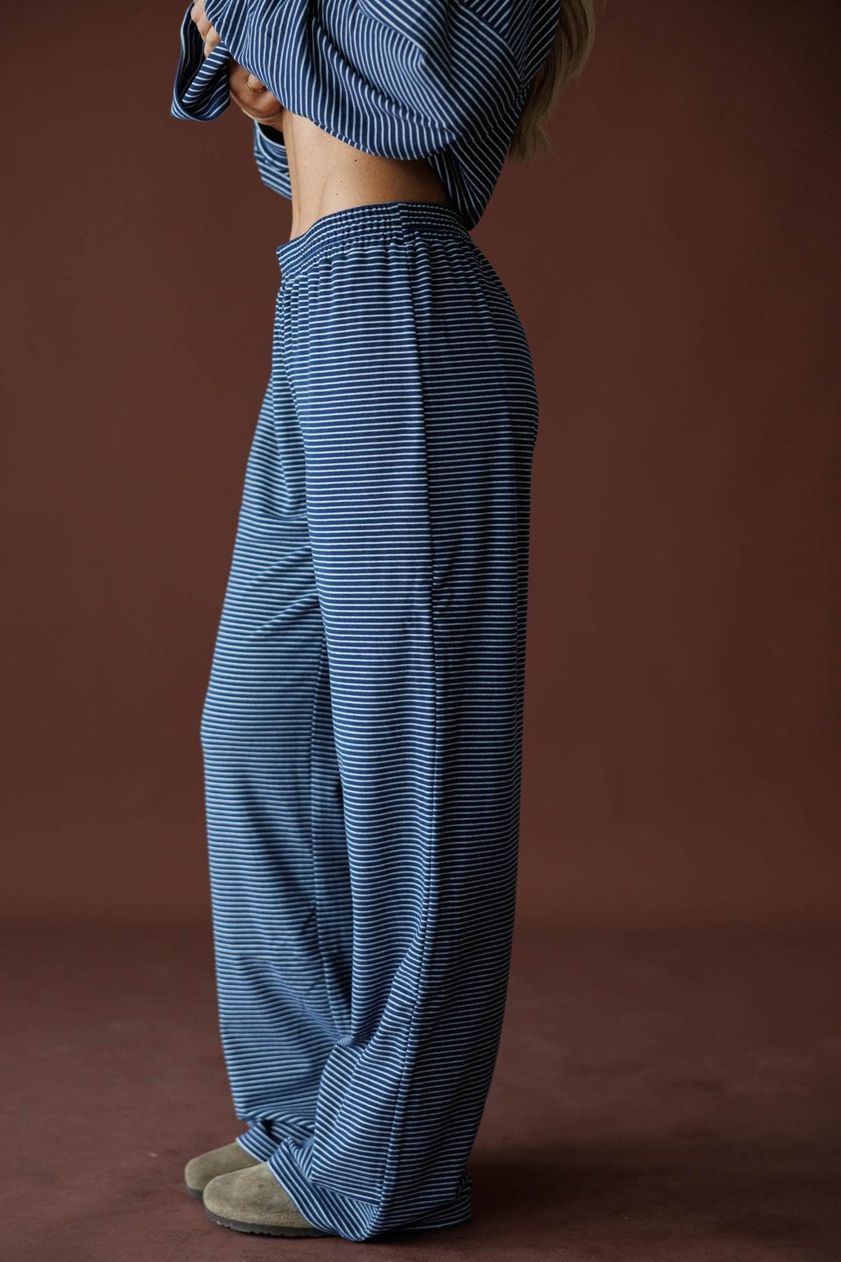 The Social Club Fleece Pants in navy, side view showing the wide leg ribbed fleece