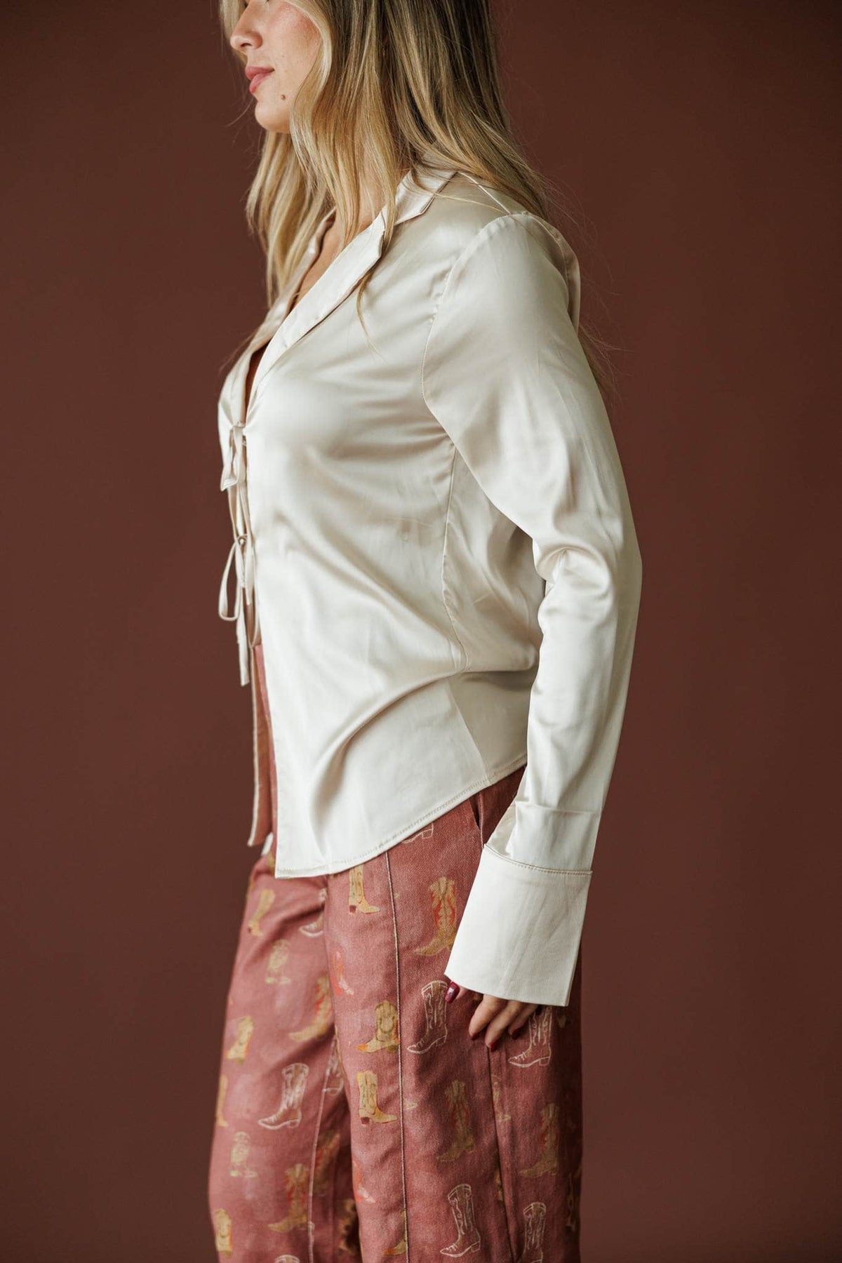 Tied To You Satin Blouse in cream, side view showing the satin blouse and lace up front