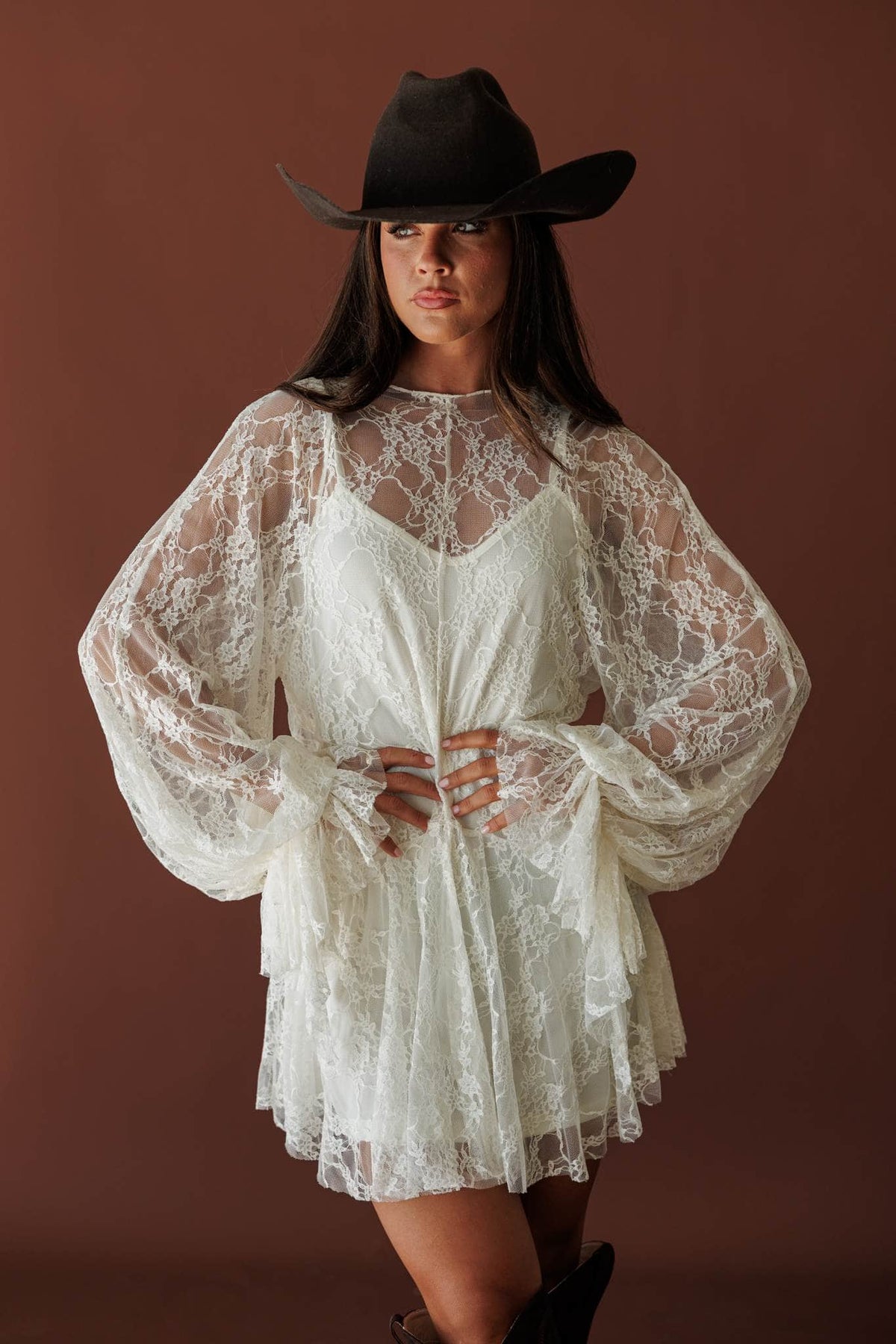 Lace Legend Mini Dress, in cream, front view with a black hat