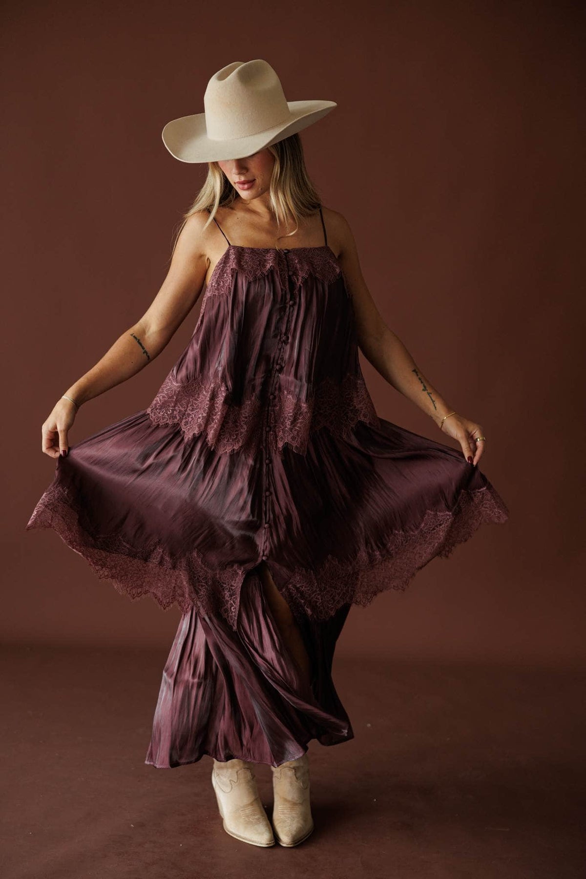Where The Wildflowers Grow Maxi Dress in plum, full-length view with the skirt held out