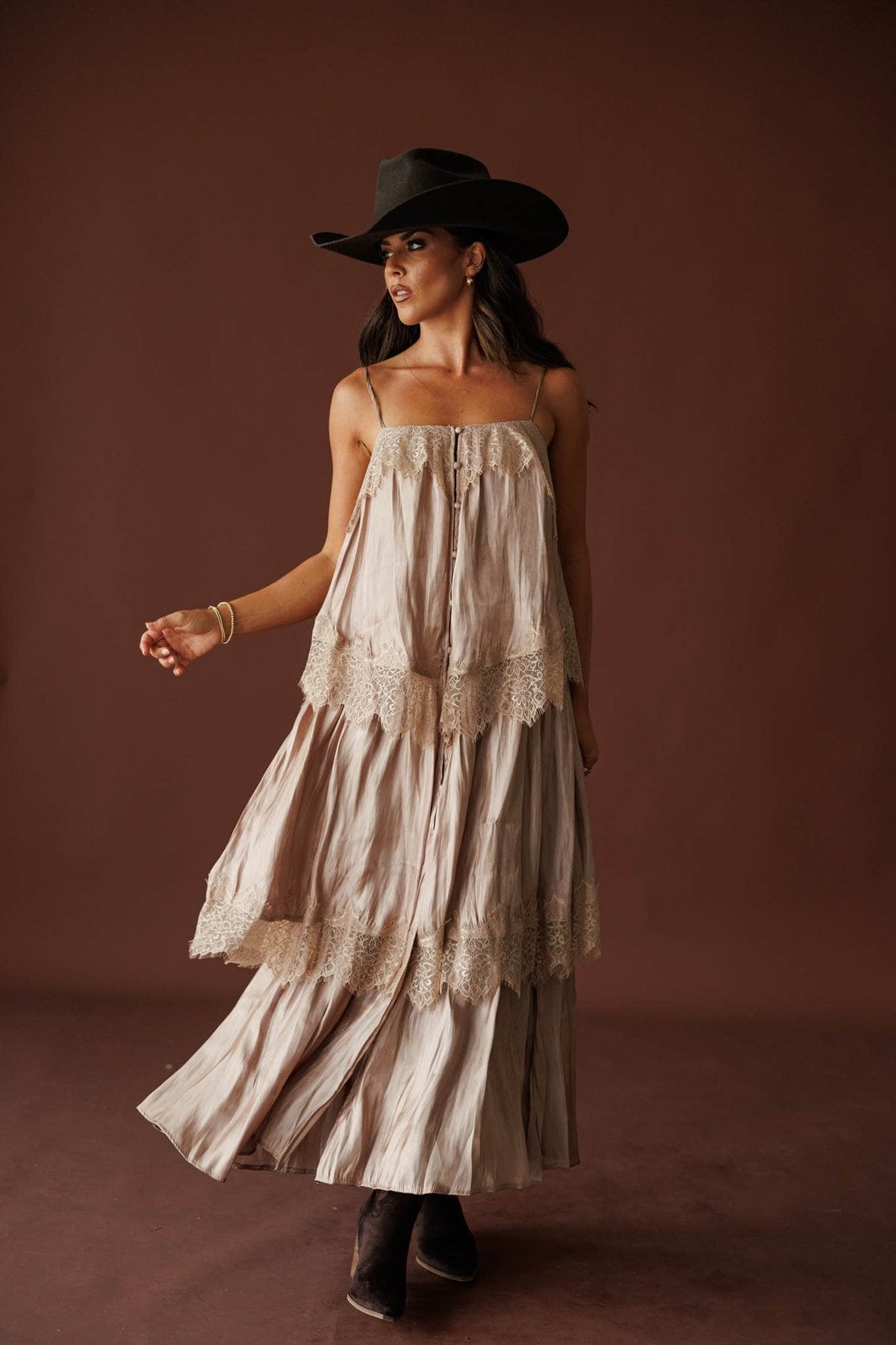 Where The Wildflowers Grow Maxi Dress in sand, full-length walking view with a black cowboy hat