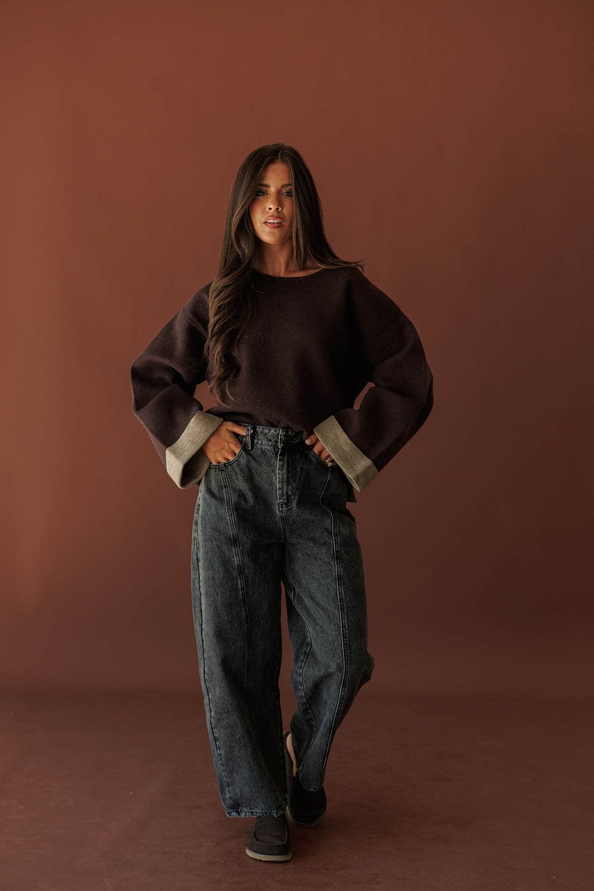 Blackout Barrel Jeans, full-length view with a brown sweater