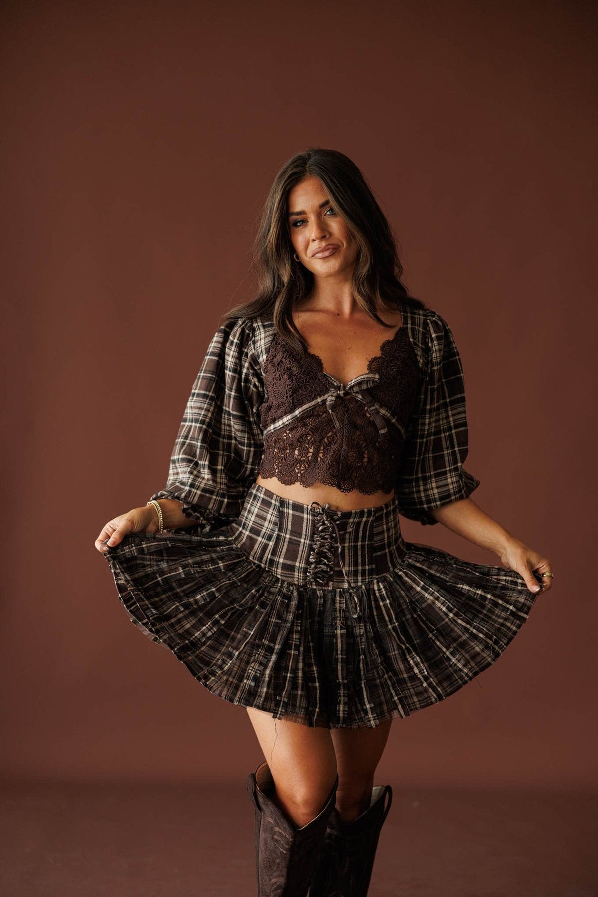 Harvest Social Plaid Skort in chocolate, full-length view with the pleated skirt in motion