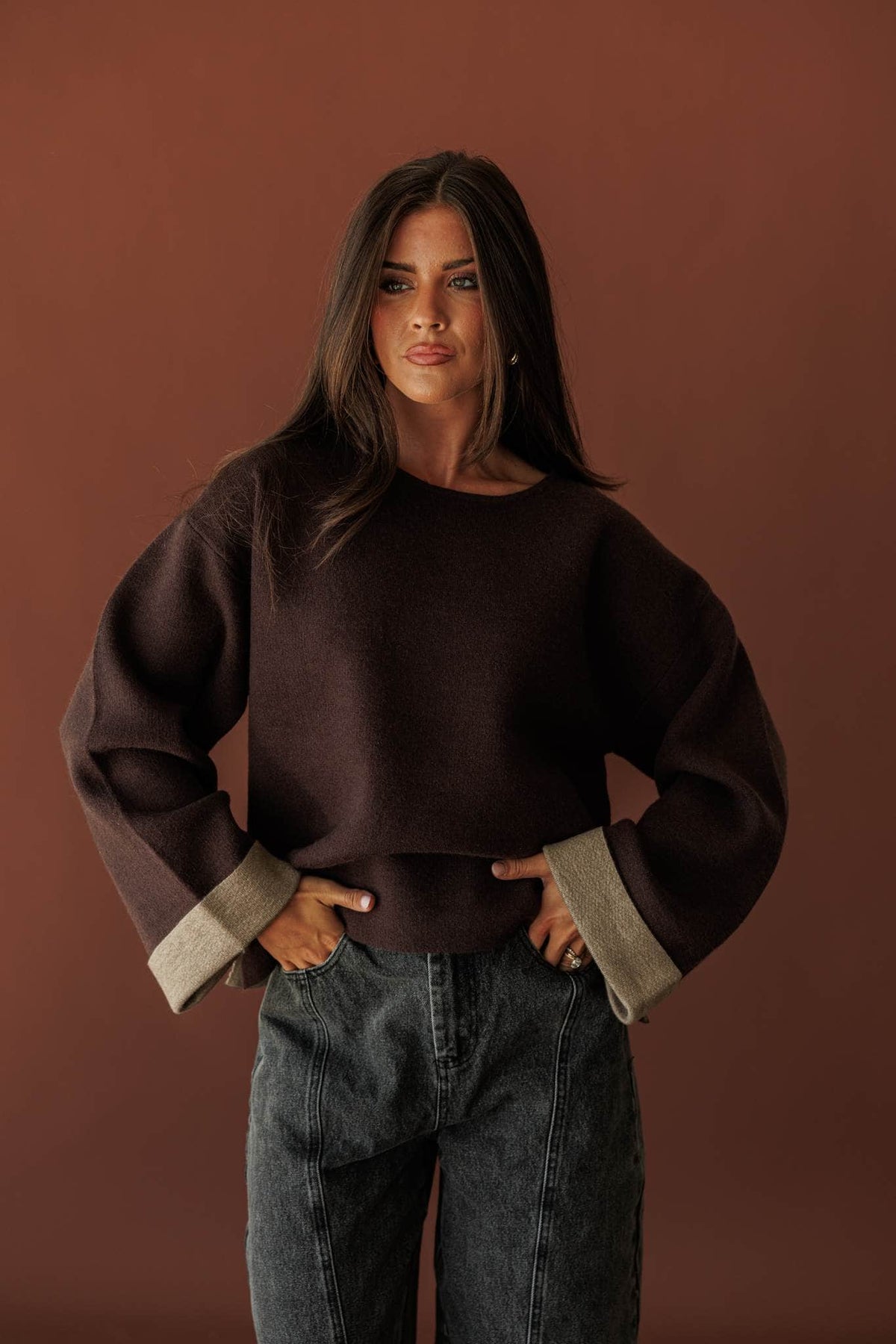 Cuffed In Contrast Sweater, front view of the contrast cuffs with denim
