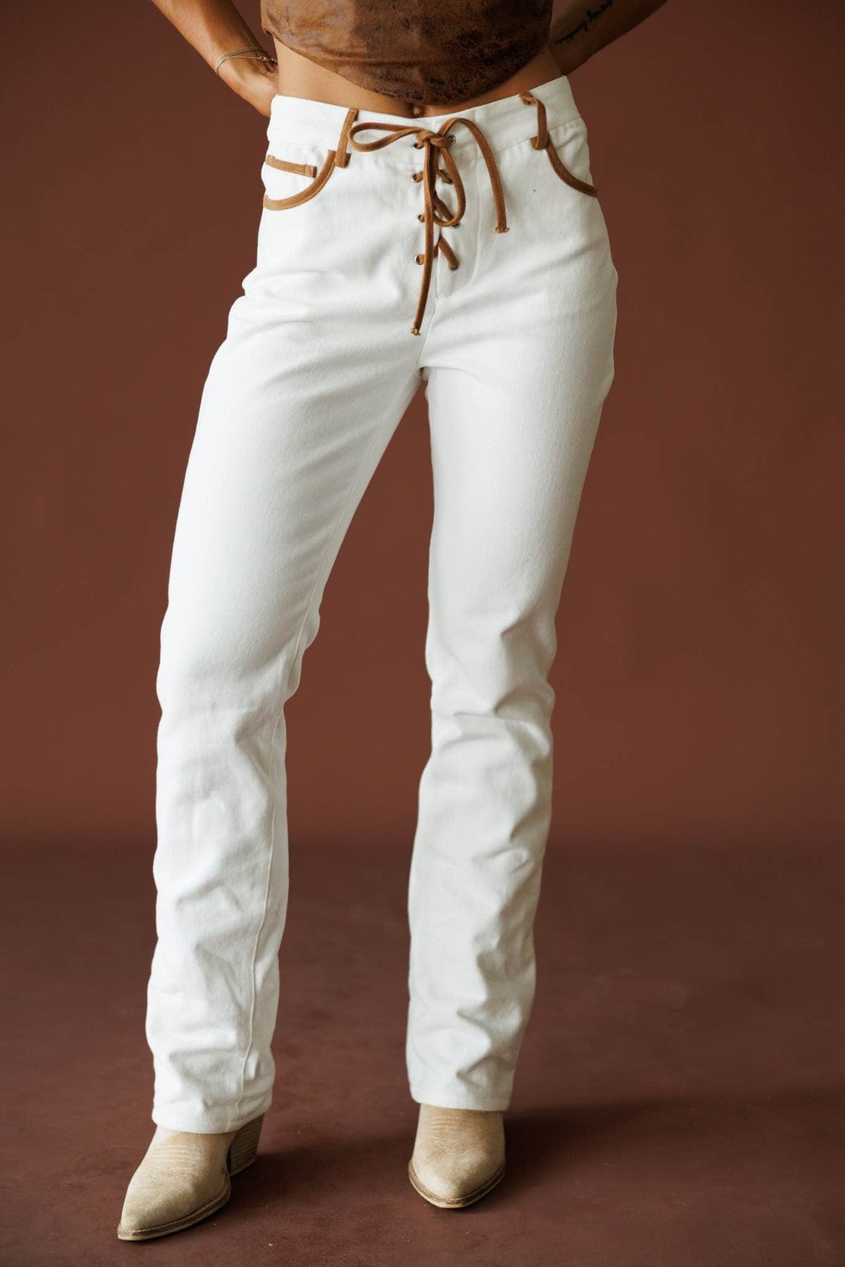 West Coast Wild Jeans in ivory, front view showing the lace up waist and straight leg
