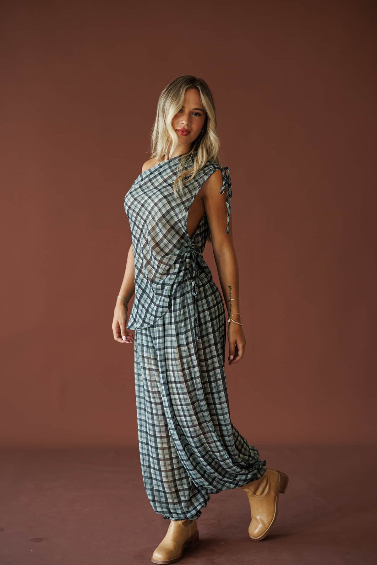 Willow Retreat Pants in grey combo plaid, full-length view on model walking